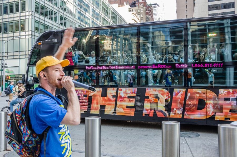 New York City: The Ride Interactive Bus Tour - Street performers turn the sidewalk into a stage