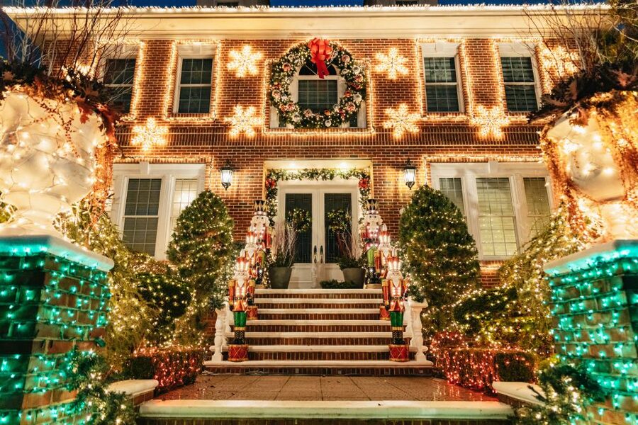 NYC: Dyker Heights Christmas Lights & Skyline View Bus Tour - Battery Park City: sunset, bathrooms, and the Statue of Liberty
