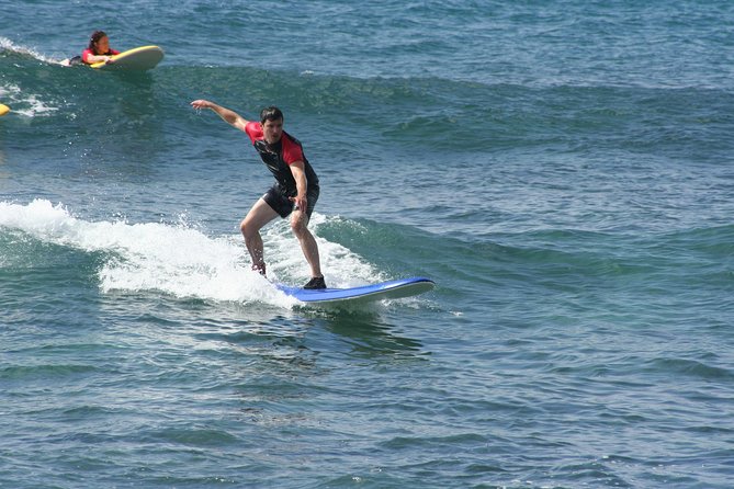 Po'ipu Surf Lesson - Learning the pop-up before meeting the waves