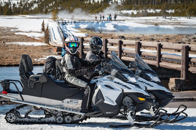 Yellowstone Old Faithful Full-Day Snowmobile Tour from Jackson Hole - Riding through the snowy park
